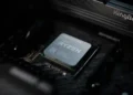 A close-up view of an AMD Ryzen 9 9950X processor installed on a computer motherboard, exemplifying cutting-edge performance standards.
