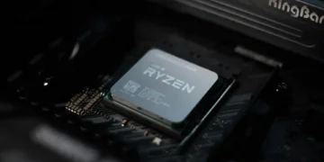 A close-up view of an AMD Ryzen 9 9950X processor installed on a computer motherboard, exemplifying cutting-edge performance standards.