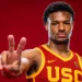 A basketball player in a USC jersey, potentially Bronny James, holds up two fingers against a red background as he eyes spots in the 2024 NBA Draft.
