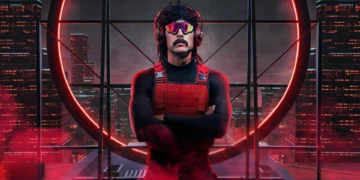 A person with a mustache and sunglasses, wearing a red vest and headphones, stands with arms crossed against a backdrop of a circular window with a city skyline illuminated in red. It’s like Dr. Disrespect after being featured in the latest gaming news, post-Twitch ban.