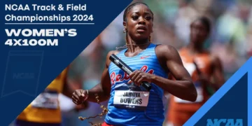 An Ole Miss athlete in a blue and red uniform runs in the Women's 4x100m relay at the NCAA Track & Field Championships 2024, holding a baton. Text on image: "Women's 4x100m.