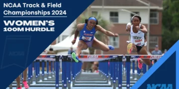 Two female athletes are competing in the NCAA Women's 100m Hurdles at the Track & Field Championships 2024. They are mid-air, jumping over hurdles, showcasing their incredible athleticism and determination.