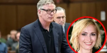 A man wearing glasses and a suit stands in a room, possibly reflecting on the recent Alec Baldwin trial, while an inset red circle features a smiling woman with blonde hair.