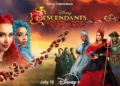 Promotional image for Disney Channel's "Descendants: The Rise of Red" featuring character portraits in colorful costumes against a dramatic sky backdrop. Catch the premiere on July 12 on Disney+. Don't miss the magic of Descendants 2024!