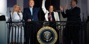 Joe Biden and Kamala Harris holding hands. Joe Biden drops out-Kamala Harris endorsed