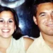 A man and woman smile at the camera while sitting closely together, their expressions masking a tragic past linked to the notorious 2002 murder involving Scott Peterson’s wife and unborn child. The background is slightly blurred.