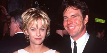 Dennis Quaid Meg Ryan dressed formally at an event, beaming at the camera, evoking a timeless charm reminiscent of Meg Ryan and Dennis Quaid.