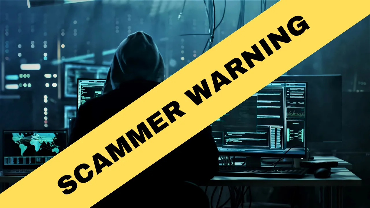 A person in a dark room sits at a computer with multiple screens displaying data. Overlaid in yellow text reads "SCAMMER WARNING," as the Kenosha sheriff warns of scammers targeting residents.
