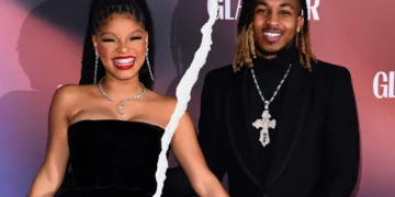 Two people smiling in formal attire with a ripped effect between them, reminiscent of Halle Bailey's captivating style.
