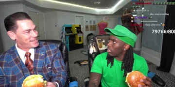 Two people are enjoying Chicken Big Macs while seated at a gaming setup. One is in a suit, the other dressed in green, reminiscent of Kai Cenat's style. Chat messages flash across the screen, adding to the lively atmosphere.