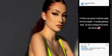 A woman with red hair in a neon top stands next to a smartphone displaying a message about weight changes due to cancer treatment, echoing Bhad Bhabie's journey and rejecting negative narratives.