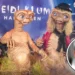 Two people dressed as E.T. characters at a costume event with a themed backdrop capture the spirit of Halloween costumes. Inset shows Heidi Klum's face, adding an extra touch of celebrity charm to the scene.