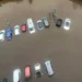 Aerial view of multiple cars partially submerged in floodwater in a parking lot, a result of the torrential rain sweeping through North-West England.